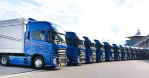 Fleet of blue lorries lined up in a semicircle